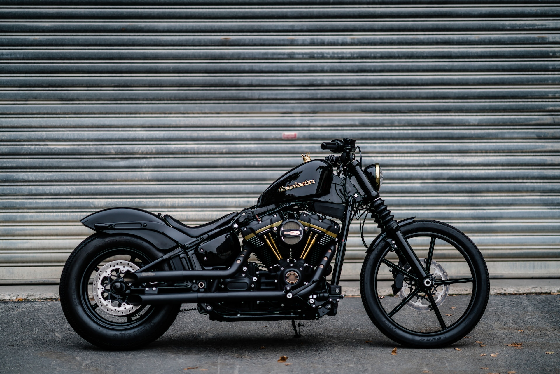 Harley Davidson Motorcycle in front of a workshop door