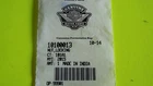 Close-up of a white ticket or badge with a barcode on a bright yellow surface.