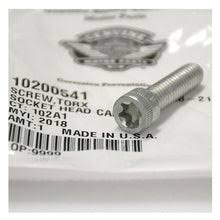 Close-up of a silver hex-socket bolt on packaging with barcode and 'Made in USA' text.