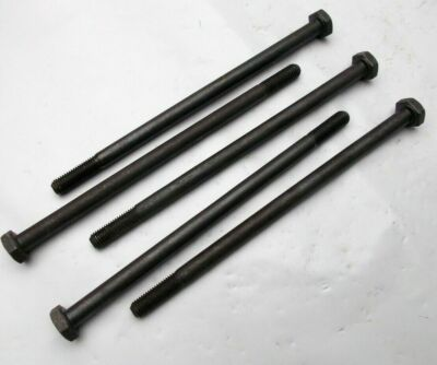 Five black hex-headed bolts of varying lengths arranged diagonally on a light surface, with threaded sections visible.