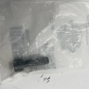 Small black threaded bolt inside a clear plastic bag with a barcode nearby