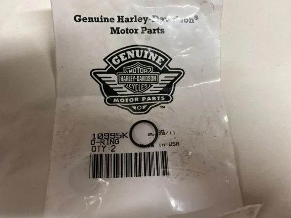 Harley-Davidson Genuine Motor Parts package with a small circular ring and barcode label on a white background