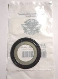 Black rubber O-ring seal packaged in a clear plastic bag with a barcode label and brand logo visible behind it, likely a replacement gasket.