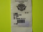 Shipping label with barcode and logo on a bright yellow surface (likely on a package).