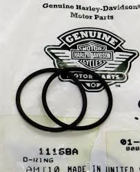 Two black piston rings on a Genuine Harley‑Davidson motor parts bag showing part number 11156A.