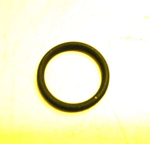 11190 | Harley-davidson® Online Close-up of a black rubber O-ring placed on a pale yellow surface.
