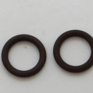 Two black rubber O-rings placed side by side on a light background.