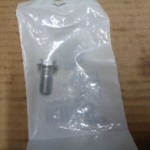 Metal bolt with washer resting on a translucent plastic bag on a wooden workbench.