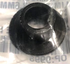Black rubber grommet with a central hole, viewed top-down on a blurred background.