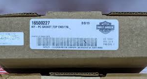 Brown cardboard box featuring a white shipping label with a barcode and the code 16500227.