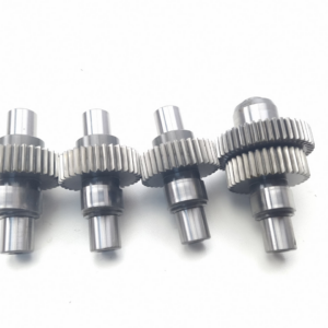 Metal shaft with four intermeshing spur gears in a row, a precision mechanical gear train.