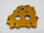 Yellow Swiss-style cheese slice with round holes on a white background.