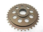 Metal gear cog with teeth and several round holes, viewed from the top.