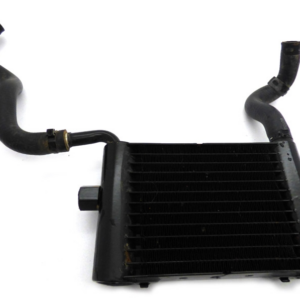 Automotive intercooler with two attached rubber hoses on a white background.
