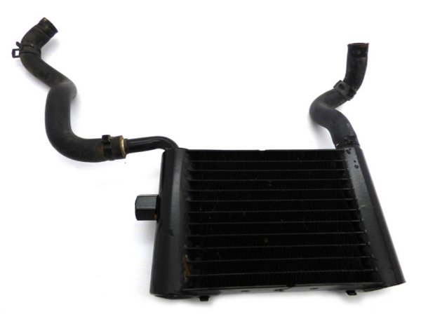 Automotive intercooler with two attached rubber hoses on a white background.