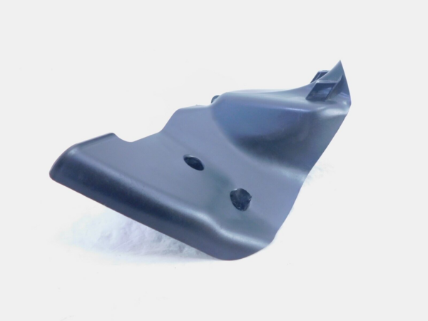 Dark gray plastic automotive mounting bracket with two circular holes and a curved, contoured surface against a white background.