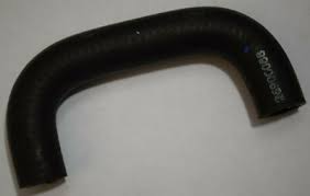Black curved rubber hose with ribbed texture, used in automotive cooling or intake systems as a hose component.