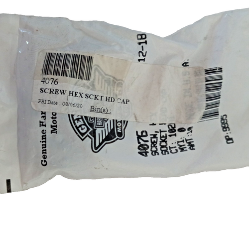 4076 | Harley-davidson® Online Plastic bag packaging for a hex socket head cap screw, with a barcode label and printed product text visible (e.g., 'SCREW HEX SCKT HD CAP'), orientation rotated.