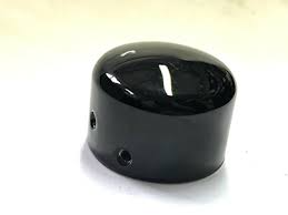 Glossy black plastic knob with a rounded dome top and two small side holes on a white surface.