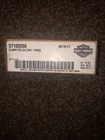 Barcode label with alphanumeric code on a dark textured surface