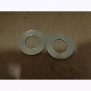 Two metal washers placed side by side on a brown surface.