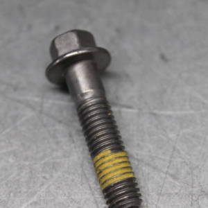 Bolt with hex head and flange, showing yellow threadlocker on the threaded portion