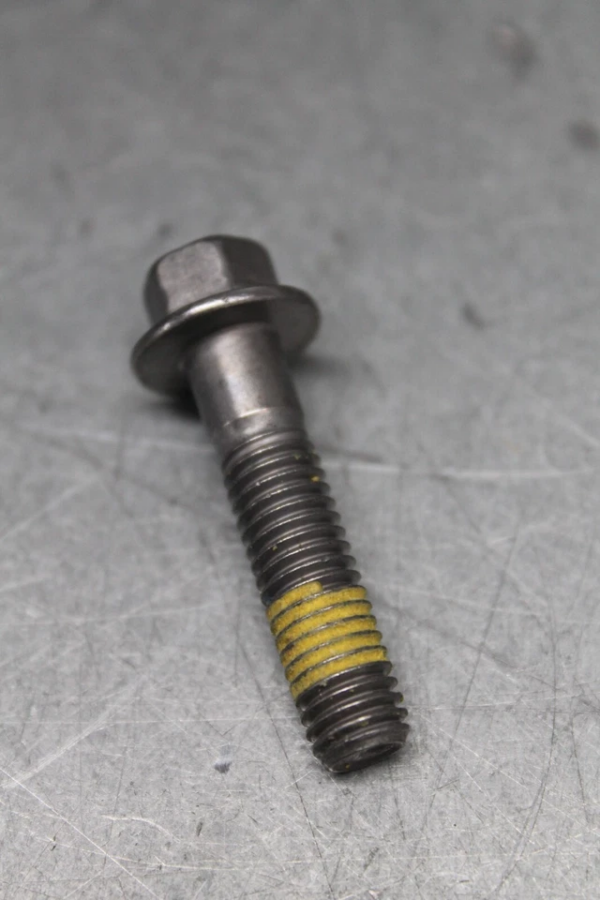 10200994 | Harley-davidson® Online Bolt with hex head and flange, showing yellow threadlocker on the threaded portion