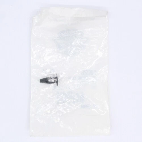 Small metal screw inside a transparent plastic bag on a white background.