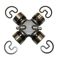 Cross-shaped universal joint (U-joint) with four bearing caps, viewed top-down.
