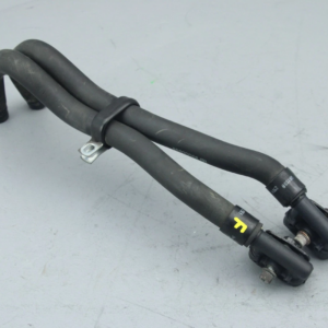 Twin black rubber automotive hoses with metal clamps and a tension strap, part of a vehicle hose assembly.