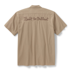 Beige short-sleeve shirt shown from the back with 'Built to Outlast' embroidered in brown script on the upper back.