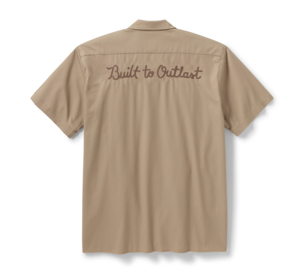 Beige short-sleeve shirt shown from the back with 'Built to Outlast' embroidered in brown script on the upper back.