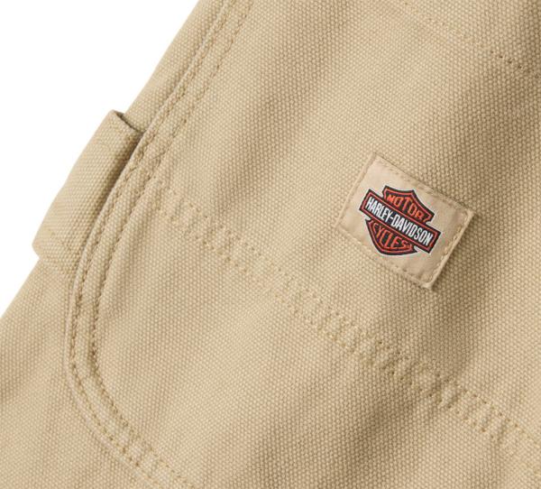 Beige canvas bag with a small Harley-Davidson logo patch sewn onto the fabric.