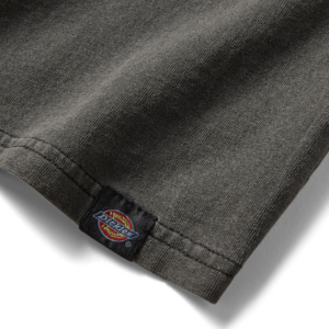 Close-up of a dark gray sleeve hem with a small Dickies logo tag woven into the seam.