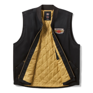 Black Dickies vest unzipped to show tan quilted interior and left-chest logo patch, front pockets visible.