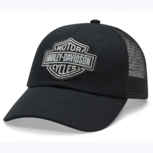 Black trucker cap with a padded front panel and a Harley‑Davidson shield logo on the crown, curved brim and mesh back.