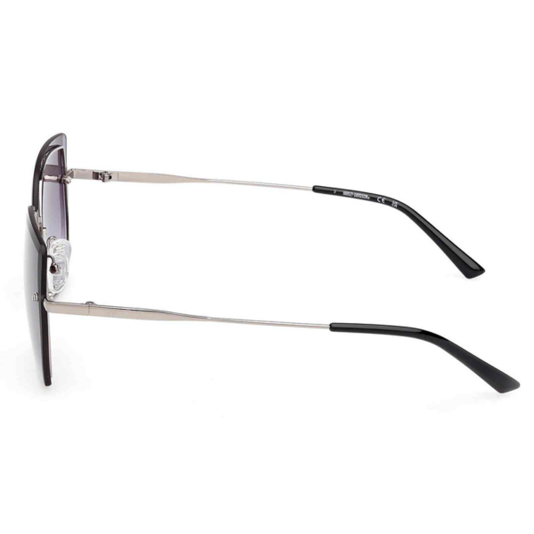 Side view of metal-framed eyeglasses with clear nose pads and black temple tips on white background