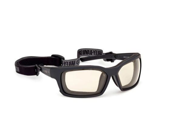 Black protective safety goggles with adjustable elastic strap and light beige lenses.