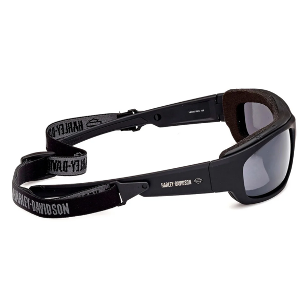 Hz0007-c02 C | Harley-davidson® Online Black motorcycle goggles with padded brow and adjustable elastic strap printed with Harley-Davidson branding on a white background.