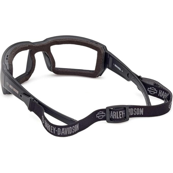 Black safety goggles with brown foam padding and an adjustable Harley‑Davidson strap.